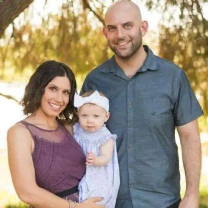 Rachel Sibner with her partner and child.